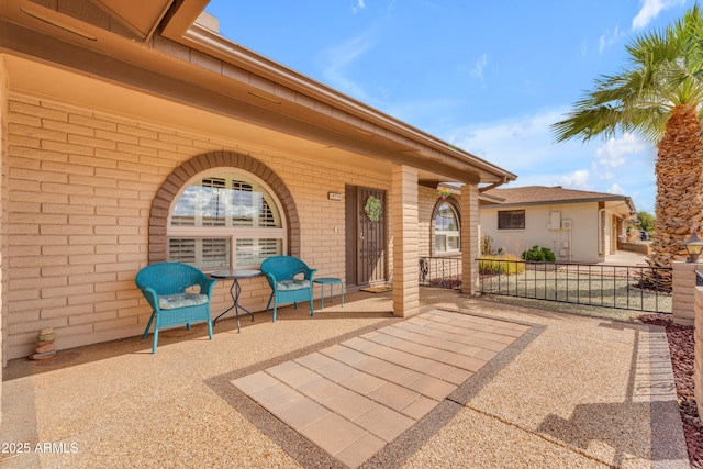 view of patio / terrace featuring fence