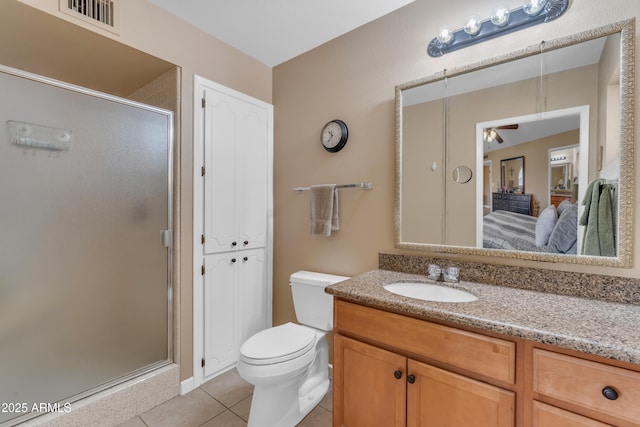 ensuite bathroom featuring visible vents, a shower stall, ensuite bathroom, tile patterned floors, and vanity