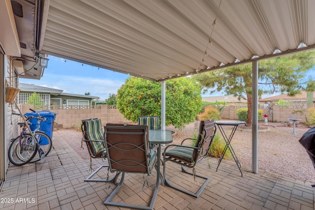 view of patio / terrace with outdoor dining area and a fenced backyard