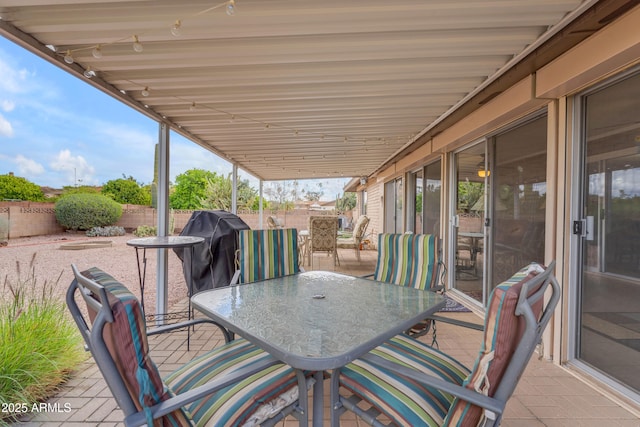 view of patio / terrace with outdoor dining area and a fenced backyard