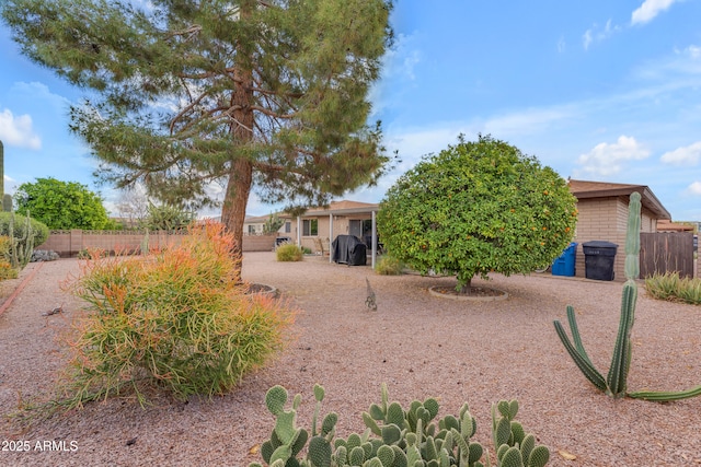 view of front of home featuring fence