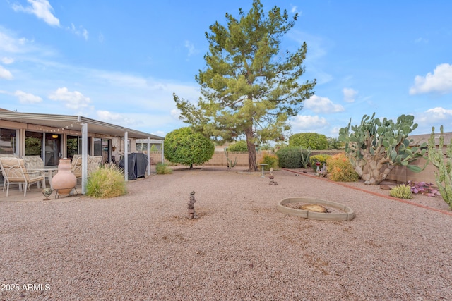 view of yard featuring a patio and fence