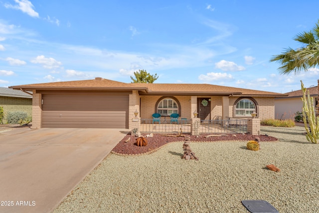 ranch-style home featuring a garage, brick siding, and concrete driveway