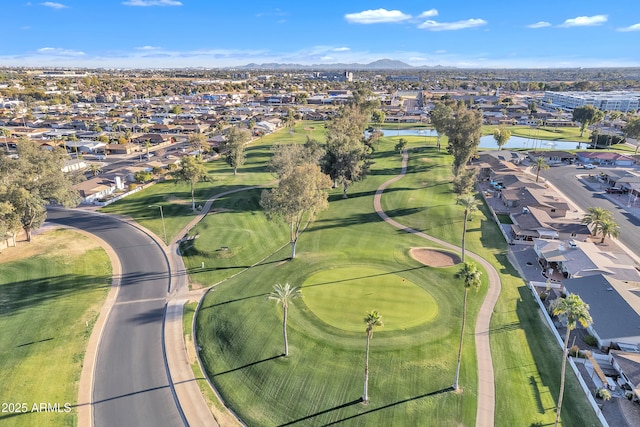 birds eye view of property featuring a residential view, view of golf course, and a water view