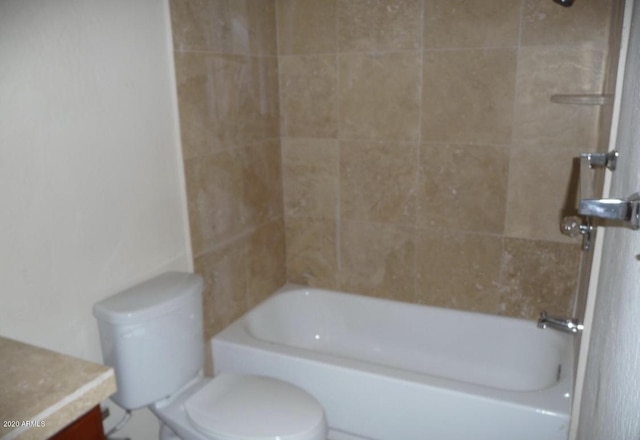 full bathroom featuring vanity, toilet, and tiled shower / bath combo