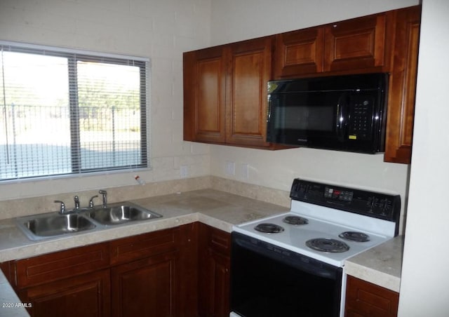 kitchen with electric range and sink