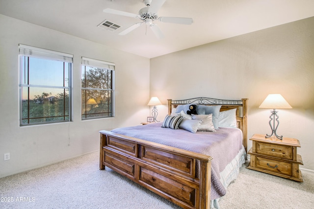 bedroom with light carpet and ceiling fan