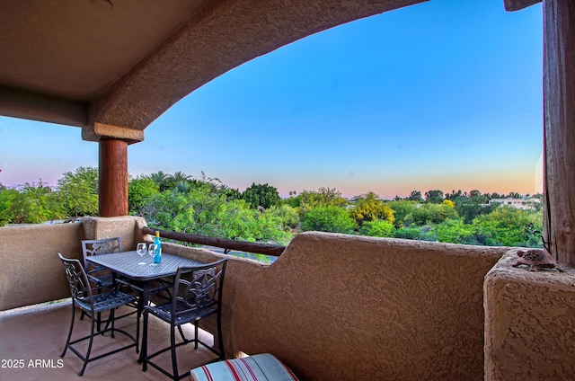 view of balcony at dusk