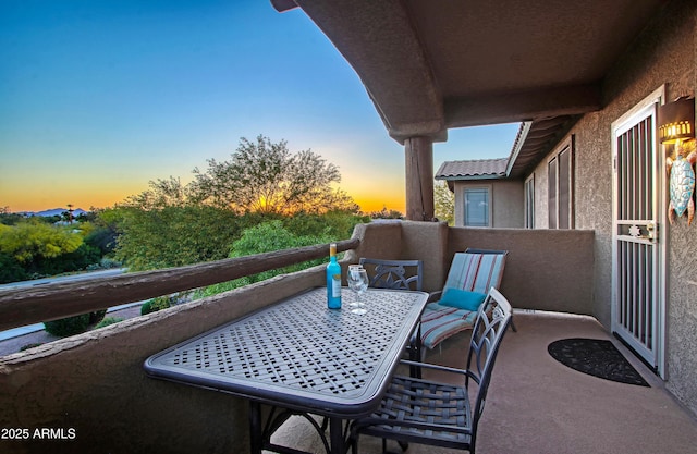 view of balcony at dusk