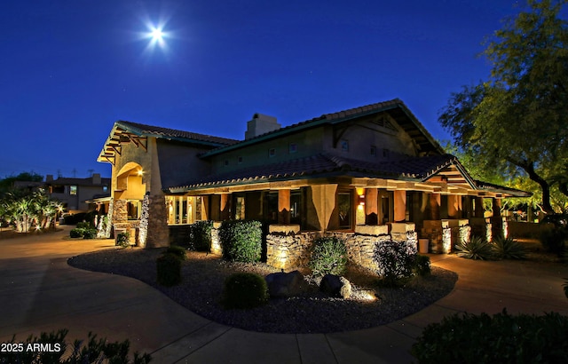 view of property exterior at night