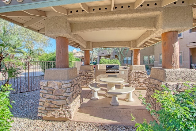 view of patio / terrace with an outdoor kitchen and area for grilling