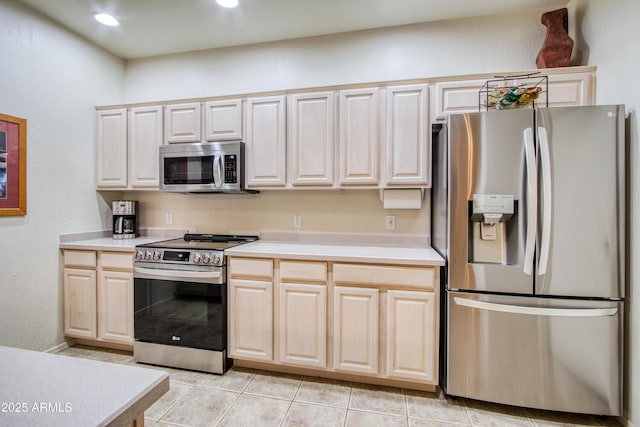 kitchen with appliances with stainless steel finishes and light tile patterned floors