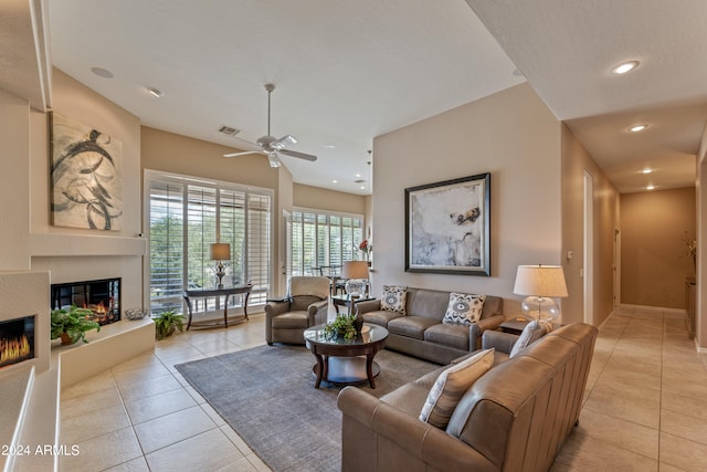 living room with light tile patterned flooring and ceiling fan