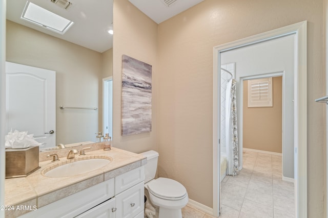 full bathroom featuring a skylight, vanity, shower / bathtub combination with curtain, tile patterned floors, and toilet