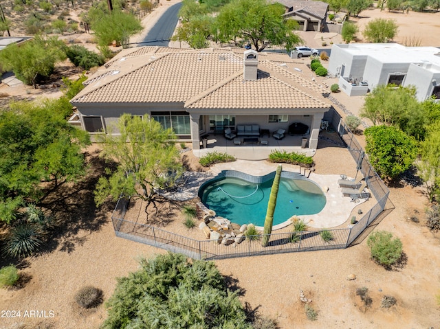 view of pool featuring a jacuzzi and a patio