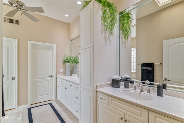 bathroom with tile patterned floors, ceiling fan, and vanity