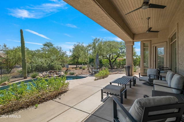 view of patio / terrace featuring ceiling fan, a fenced in pool, and an outdoor hangout area