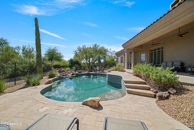 view of pool featuring a patio and ceiling fan