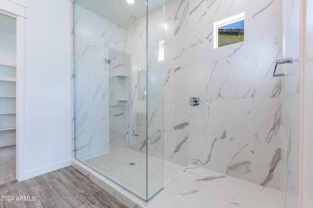 bathroom with a tile shower