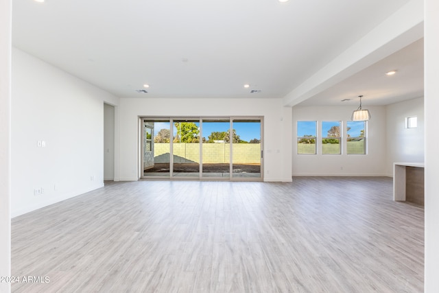 unfurnished living room featuring light hardwood / wood-style floors