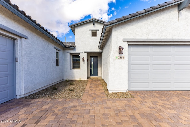 property entrance with a garage