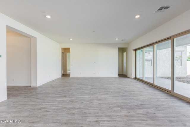 spare room with light wood-type flooring