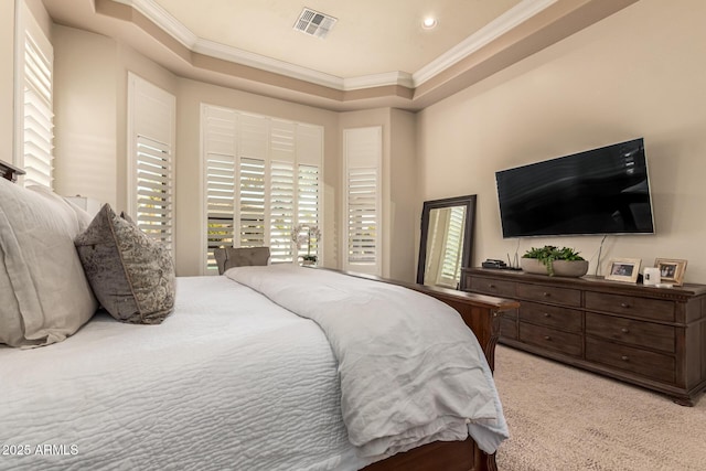 bedroom with a raised ceiling, ornamental molding, and light colored carpet