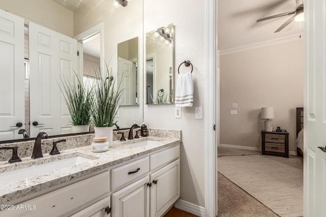 bathroom with vanity, crown molding, and ceiling fan