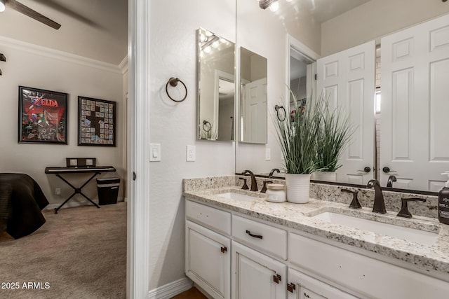 bathroom with vanity and crown molding