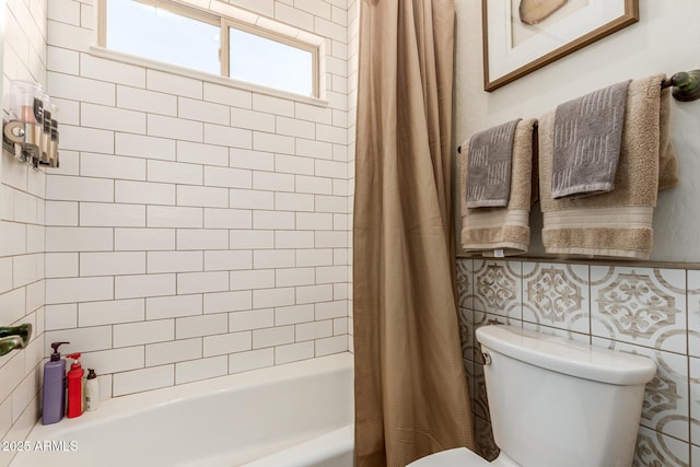 bathroom with shower / bath combo and toilet