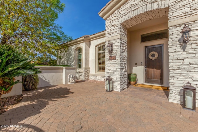 doorway to property featuring a patio