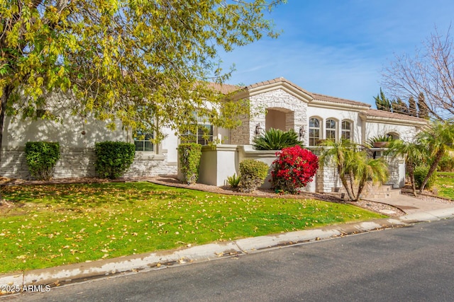 view of front facade featuring a front yard