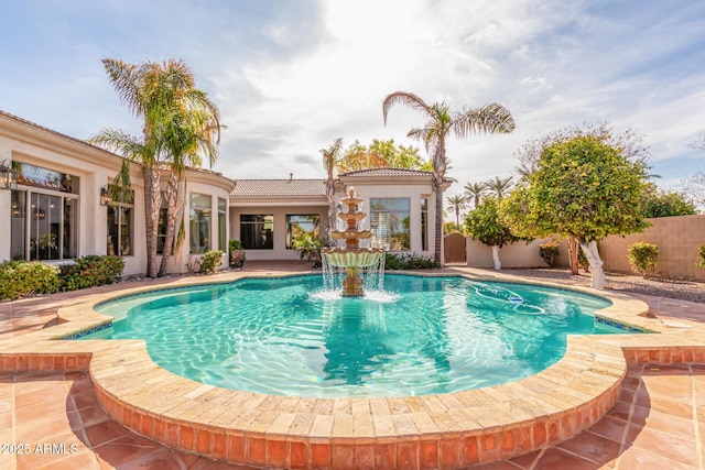 view of pool with pool water feature