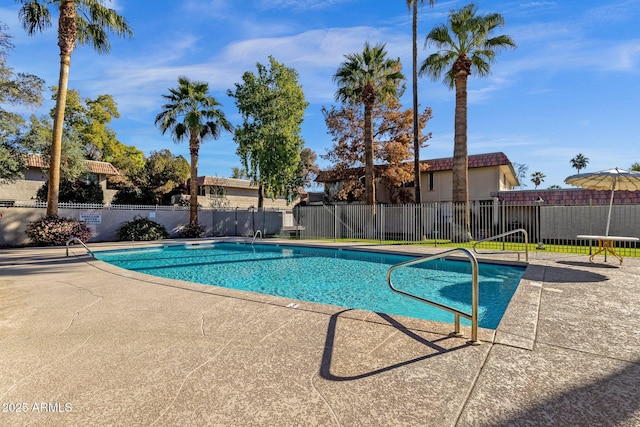 view of swimming pool with a patio area