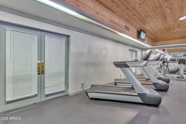 exercise room featuring lofted ceiling and wooden ceiling