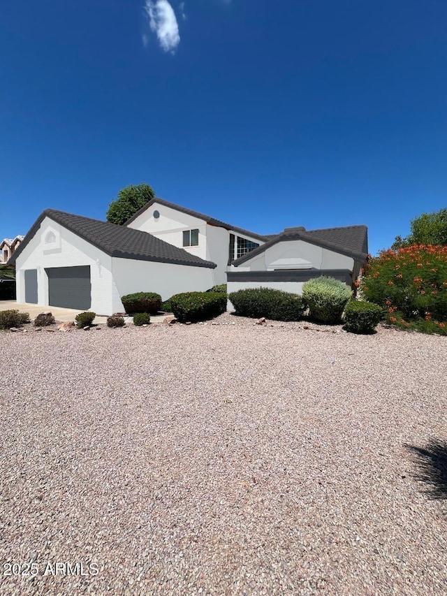 view of side of property featuring a garage