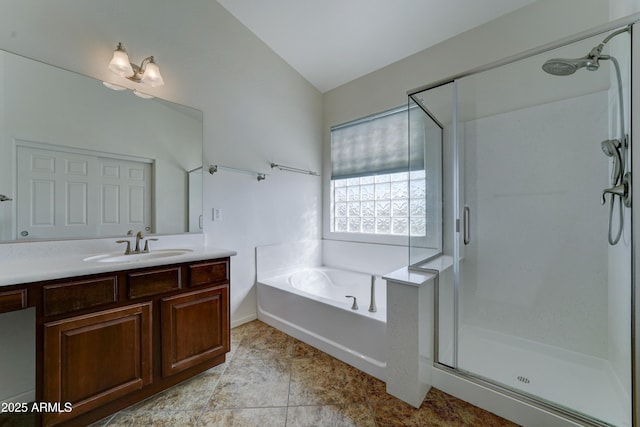 full bath with a bath, a stall shower, vanity, and vaulted ceiling