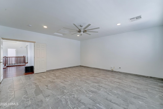 spare room featuring recessed lighting, visible vents, baseboards, and a ceiling fan