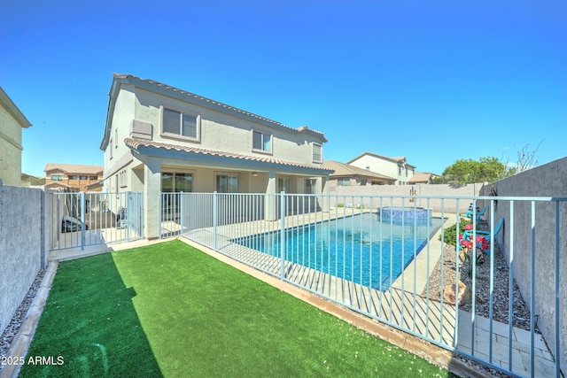 view of pool featuring a fenced in pool, a patio, a lawn, and a fenced backyard