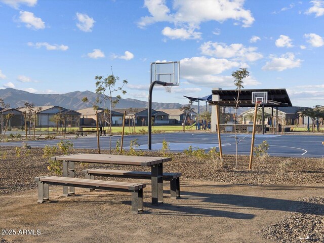 view of sport court featuring community basketball court and a mountain view