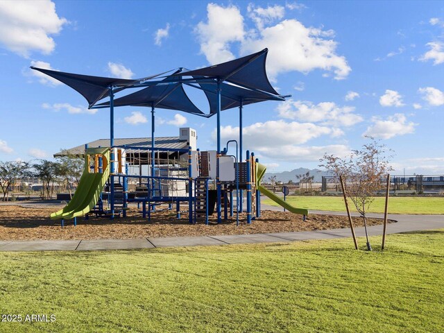 communal playground featuring a lawn