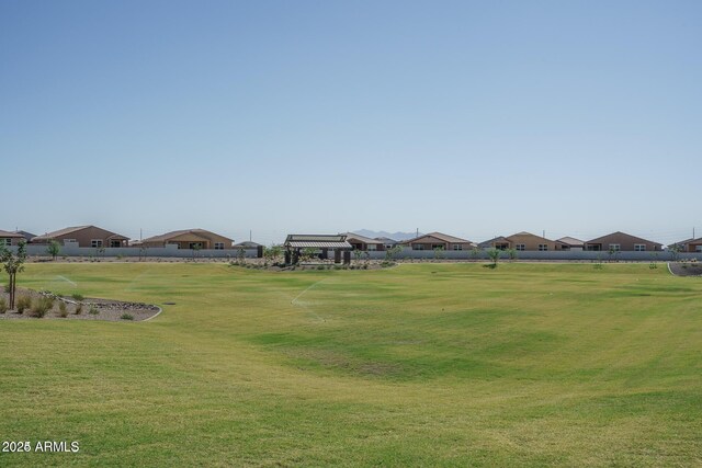 view of community featuring a residential view and a lawn