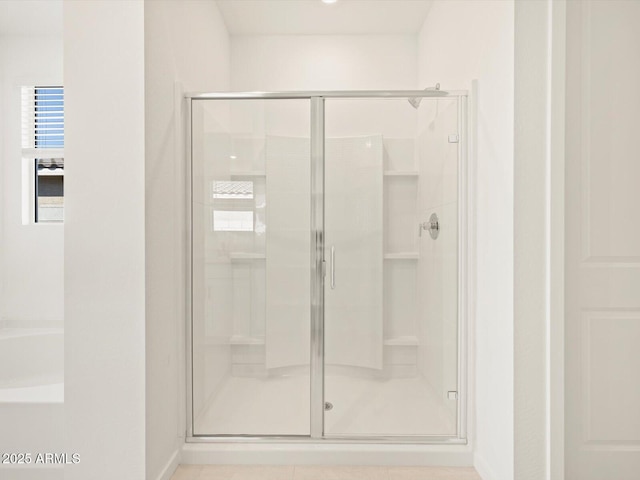 bathroom with a shower stall