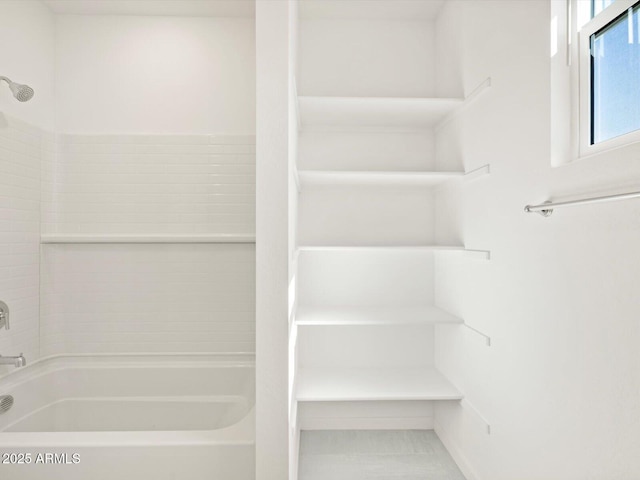 interior space featuring shower / tub combination