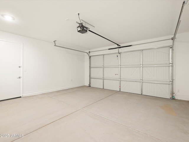 garage with baseboards and a garage door opener