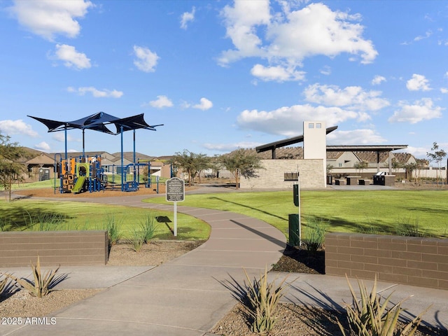 surrounding community with playground community and a yard