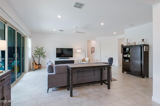 2513 E Pleasant Ln, Phoenix, AZ 85042 - living room with ceiling fan, light tile patterned flooring, and recessed lighting