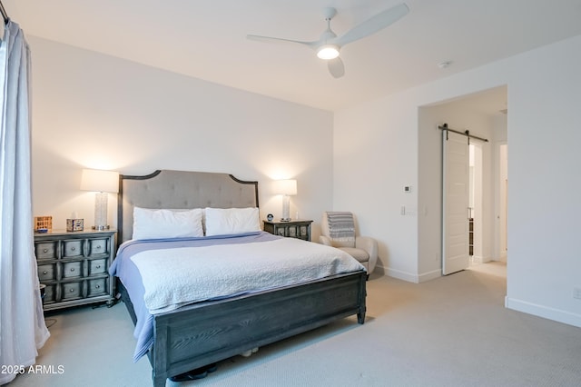 2513 E Pleasant Ln, Phoenix, AZ 85042 - carpeted bedroom featuring a barn door, baseboards, and ceiling fan