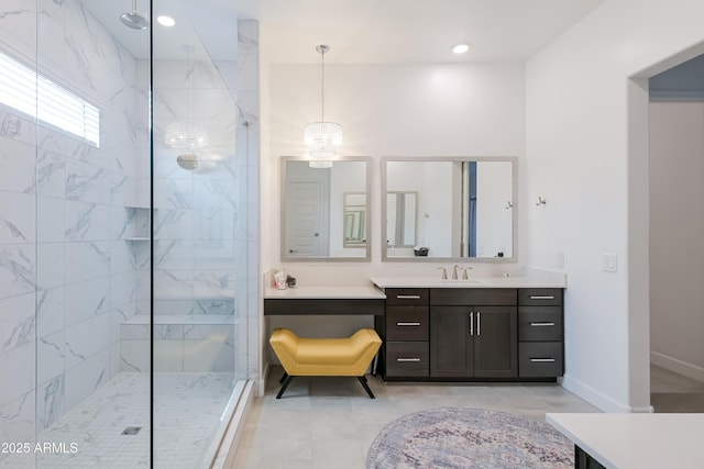 2513 E Pleasant Ln, Phoenix, AZ 85042 - bathroom featuring a marble finish shower, vanity, a chandelier, tile patterned flooring, and recessed lighting