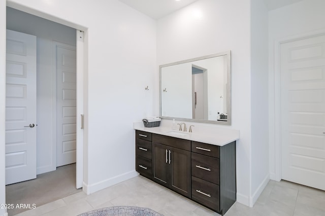 2513 E Pleasant Ln, Phoenix, AZ 85042 - bathroom featuring baseboards, vanity, and tile patterned flooring